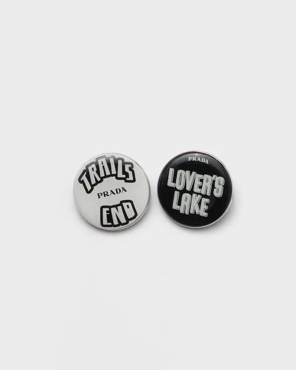 Enameled metal brooches